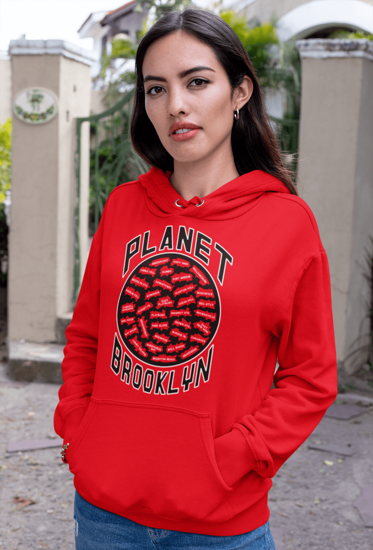 Planet-Brooklyn-Red-hoodie-woman-on-the-street.png Planet Brooklyn Hoodie - Image 1