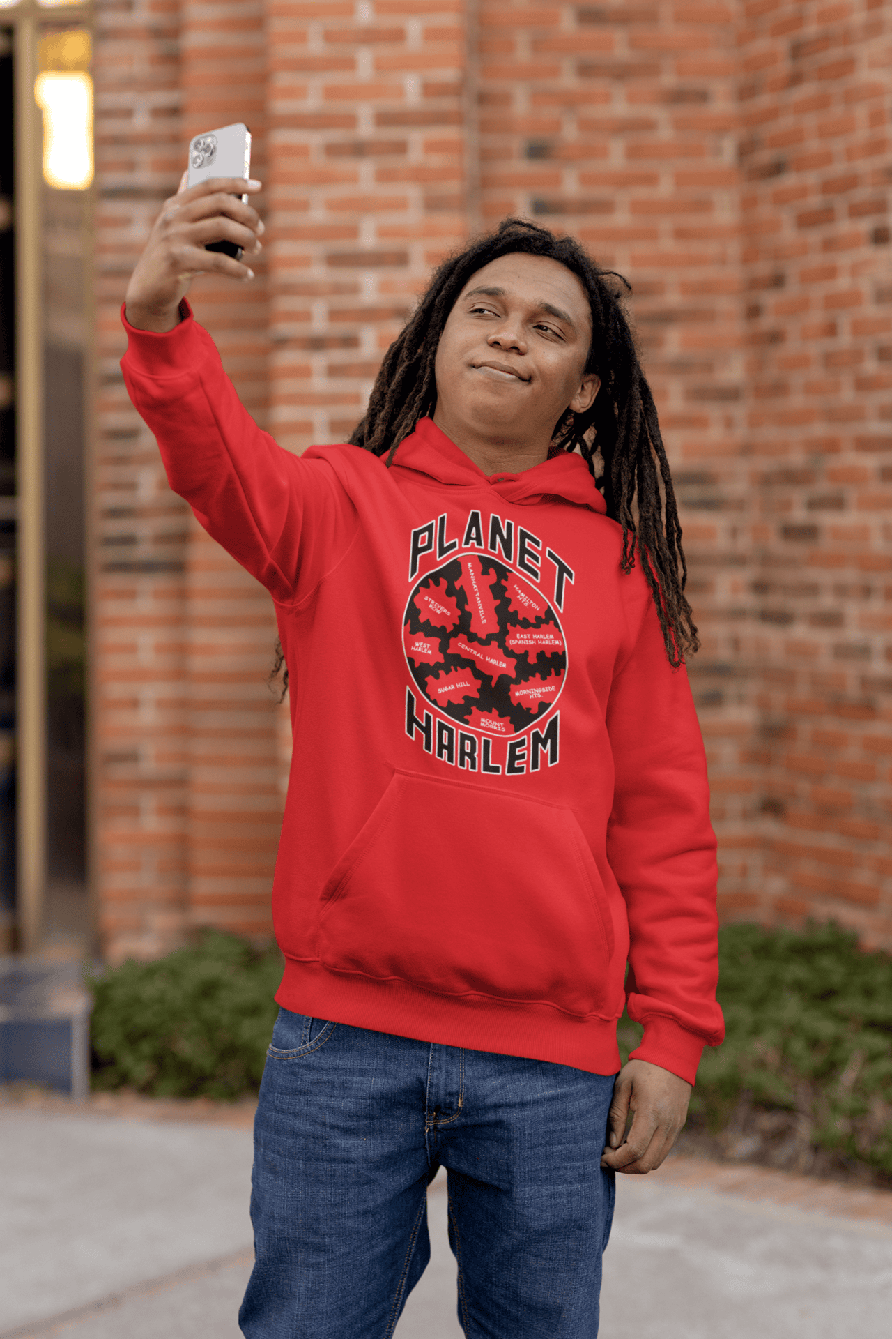Planet-Harlem-Red-hoodie-man-with-locs-taking-a-selfie.png Planet Harlem Hoodie - Image 1