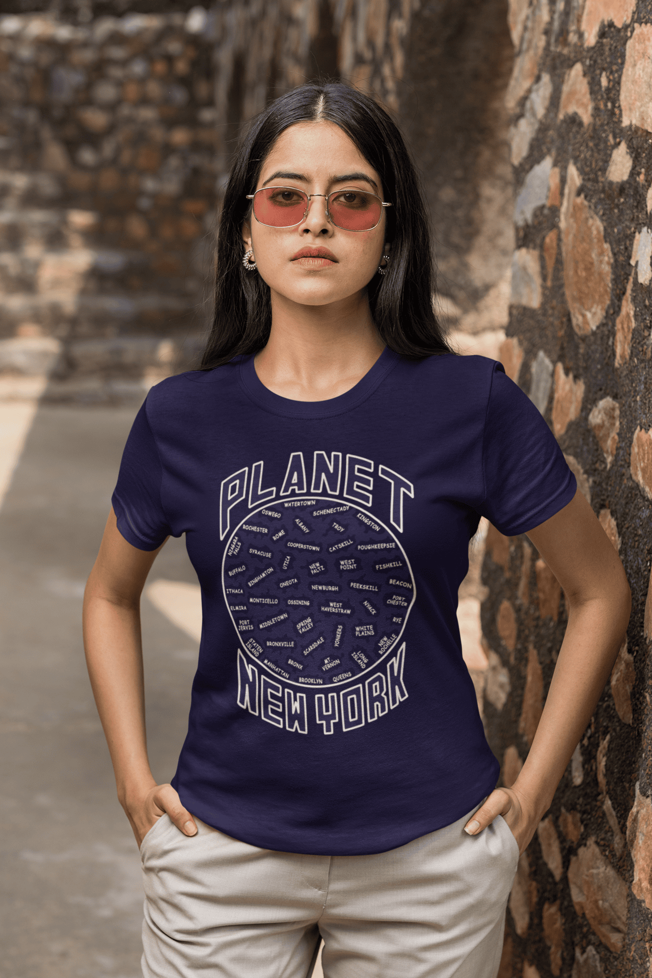 Planet-NY-Navy-blue-SS-shirt-woman-wearing-sunglasses.png Planet New York Short Sleeve - Image 1