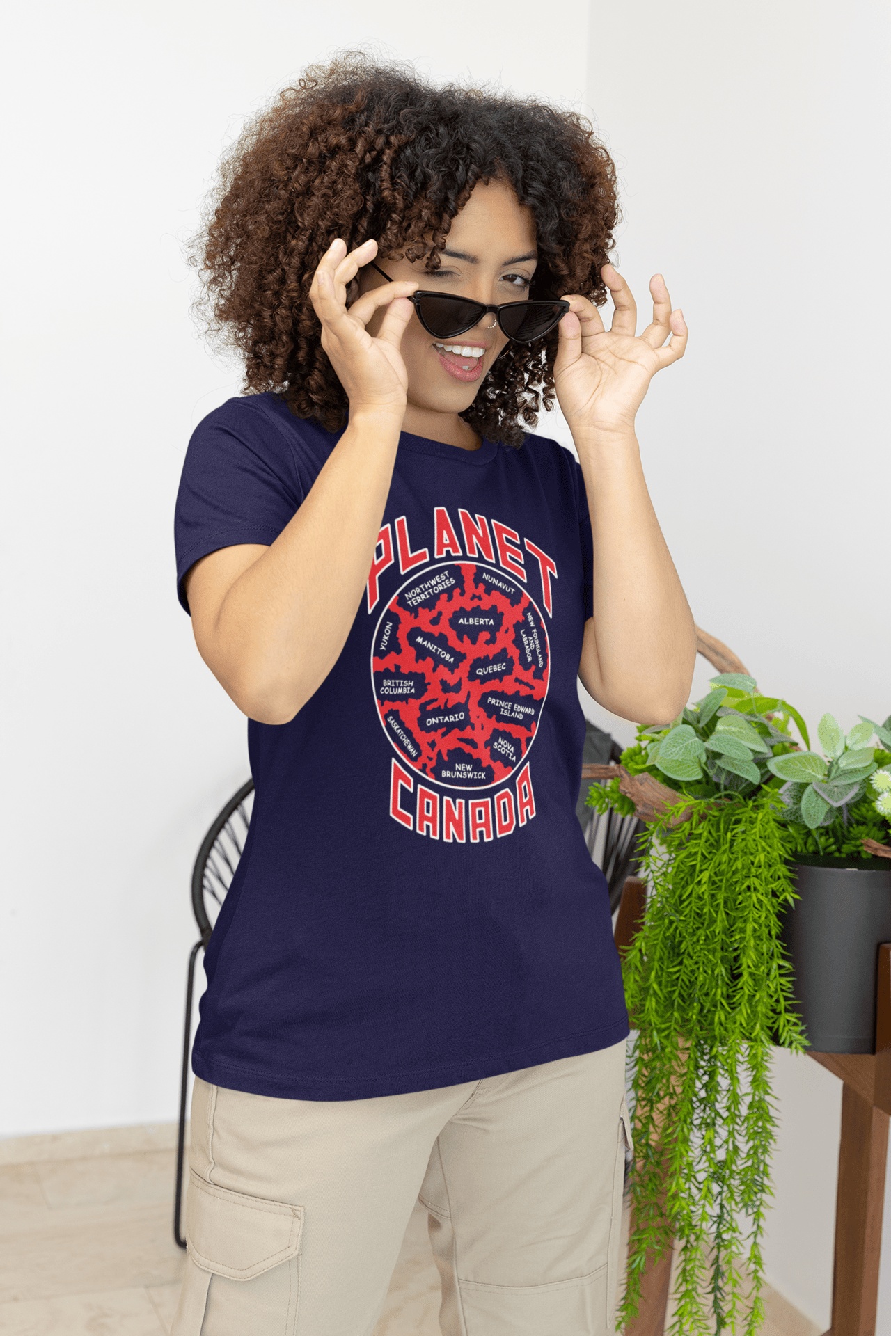Planet-Canada-Navy-blue-SS-shirt-woman-taking-off-her-sunglasses Planet Canada Short Sleeve - Image 1